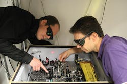 Stefan Kundermann (left) and Steve Lecomte working on the optical frequency comb.