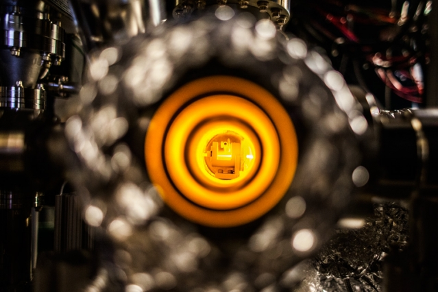 Sodium atoms diffuse out of an oven to form an atomic beam, which is then slowed and trapped using laser light for imaging with a new fermion microscope.