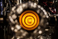 Sodium atoms diffuse out of an oven to form an atomic beam, which is then slowed and trapped using laser light for imaging with a new fermion microscope. Sodium atoms diffuse out of an oven to form an atomic beam, which is then slowed and trapped using laser light for imaging with a new fermion microscope.