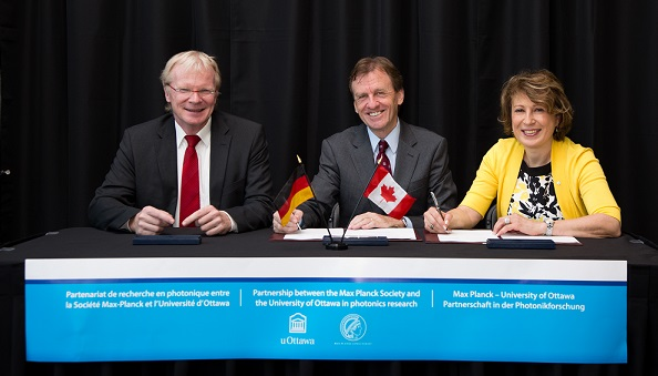 Ferdi Sch&uuml;th, vice-president of the Max Planck Society, Mona Nemer, VP research, University of Ottawa, and Allan Rock, president and vice-chancellor, University of Ottawa sign a memorandum of understanding to establish the Max Planck-University of Ottawa Centre.