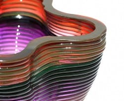 The ability to introduce variations in color into the stream of molten glass is one of the unusual properties of the new 3D glass printing system from MIT. The ability to introduce variations in color into the stream of molten glass is one of the unusual properties of the new 3D glass printing system from MIT.