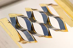 Stretched kirigami-patterned thin-film solar cells track the sun