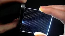 Light from a sparse hexagonal array of pinlights is projected through a spatial light modulator (SLM) to produce a wide-field image on the eye’s retina. The pinlight array and the SLM (one of each per eye) are mounted on eyeglass frames, resulting in a lightweight wearable augmented-reality display. Light from a sparse hexagonal array of pinlights is projected through a spatial light modulator (SLM) to produce a wide-field image on the eye’s retina. The pinlight array and the SLM (one of each per eye) are mounted on eyeglass frames, resulting in a lightweight wearable augmented-reality display.