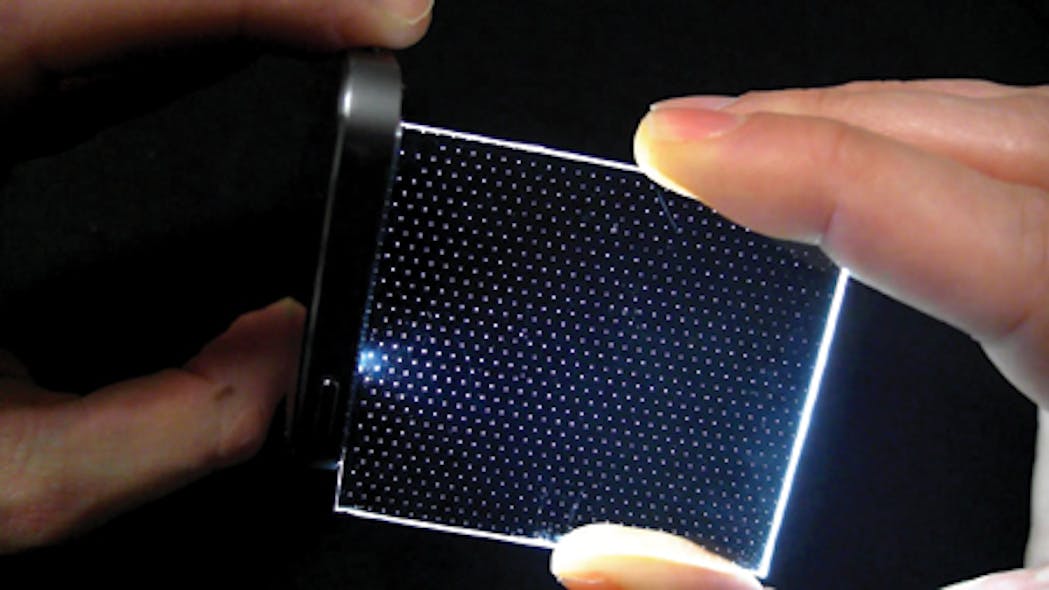 FIGURE 1. Light from a sparse hexagonal array of pinlights is projected through a spatial light modulator (SLM) to produce a wide-field image on the eye&apos;s retina. The pinlight array and the SLM (one of each per eye) are mounted on eyeglass frames, resulting in a lightweight wearable augmented-reality display.