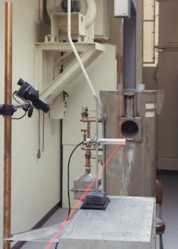 A quantum-cascade laser (QCL) in a plastic box (mounted to the post) is aligned to a cobalt-60 gamma-radiation source at PNNL’s High Exposure Facility. Positioning lasers aid the initial setup and cameras are positioned to remotely monitor instrument readings during irradiation. A quantum-cascade laser (QCL) in a plastic box (mounted to the post) is aligned to a cobalt-60 gamma-radiation source at PNNL’s High Exposure Facility. Positioning lasers aid the initial setup and cameras are positioned to remotely monitor instrument readings during irradiation.