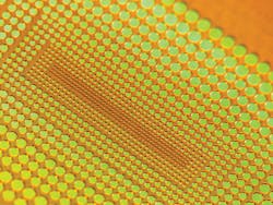 FIGURE 5. Large array of micro holes drilled in polyimide foil-a flexible polymer material commonly used in electronics-using an ultra-short pulse laser. FIGURE 5. Large array of micro holes drilled in polyimide foil-a flexible polymer material commonly used in electronics-using an ultra-short pulse laser.