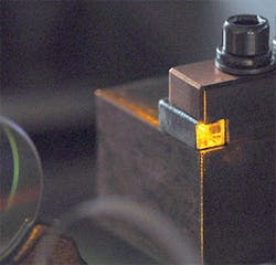 FIGURE 2. The gain element of a mode-locked mid-IR laser is made to emit in the familiar Rhodamine 6G (R6G) yellow color. The visible emission is generated in random-quasi-phase-matched polycrystalline Cr:ZnS via the fourth harmonic of 2.4 μm femtosecond radiation. FIGURE 2. The gain element of a mode-locked mid-IR laser is made to emit in the familiar Rhodamine 6G (R6G) yellow color. The visible emission is generated in random-quasi-phase-matched polycrystalline Cr:ZnS via the fourth harmonic of 2.4 μm femtosecond radiation.