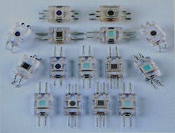 FIGURE 3. Injection-molded detector modules from Advanced Photonics, with dye added to the some of the transparent plastic molds to filter undesired wavelengths. FIGURE 3. Injection-molded detector modules from Advanced Photonics, with dye added to the some of the transparent plastic molds to filter undesired wavelengths.