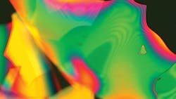 A dielectric multilayer stack coating, measuring 0.5 μm in total thickness, that has been intentionally released from the optic surface before imaging. The image was taken at 200x using a Nomarski microscope. A dielectric multilayer stack coating, measuring 0.5 μm in total thickness, that has been intentionally released from the optic surface before imaging. The image was taken at 200x using a Nomarski microscope.