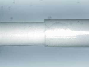 FIGURE 1. 266nm cutting of bio-absorbable material on ceramic mandrel.