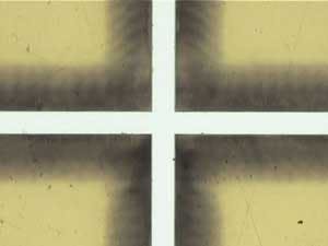 FIGURE 1a. Uncleaned, laser etched polyimide.