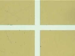 FIGURE 1b. Laser etched polyimide wiped with IPA. FIGURE 1b. Laser etched polyimide wiped with IPA.