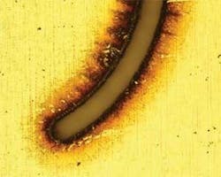 FIGURE 3a. Uncleaned, laser etched stainless steel. FIGURE 3a. Uncleaned, laser etched stainless steel.