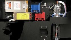 FIGURE 4. Two lasers are shown mounted on the front of the optical plate. The other two lasers are mounted in a symmetric fashion on the back side of the plate, and the spatially separated beams are combined using dichroic filters. FIGURE 4. Two lasers are shown mounted on the front of the optical plate. The other two lasers are mounted in a symmetric fashion on the back side of the plate, and the spatially separated beams are combined using dichroic filters.