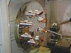 A precision two-axis diamond turning machine fabricates metal mirrors for high-power CO2 lasers. A precision two-axis diamond turning machine fabricates metal mirrors for high-power CO2 lasers.