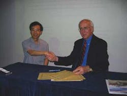 Prof. W.B. Lee and ILS Editor-In-Chief David Belforte shake hands to seal an agreement to foster technology exchange. Prof. W.B. Lee and ILS Editor-In-Chief David Belforte shake hands to seal an agreement to foster technology exchange.