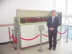 Do Youl Kim, president of Hana Engineering, poses in front of the CO2 laser he developed 20 years ago. Do Youl Kim, president of Hana Engineering, poses in front of the CO2 laser he developed 20 years ago.