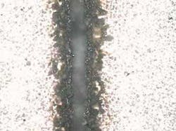 FIGURE 1d. 100-W CW fiber laser cut. FIGURE 1d. 100-W CW fiber laser cut.