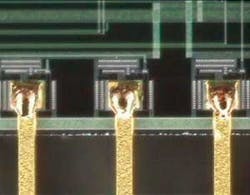 FIGURE 1. Pulsed Nd:YAG spot welds 0.005in-thick gold copper traces to metalized pad. FIGURE 1. Pulsed Nd:YAG spot welds 0.005in-thick gold copper traces to metalized pad.