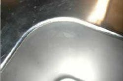 FIGURE 3. Welding a stainless steel sink to frame using an 800W diode laser. FIGURE 3. Welding a stainless steel sink to frame using an 800W diode laser.