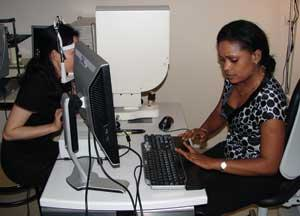 Figure 1. A doctor aligns INOVEO&rsquo;s prototype adaptive-optics system with a patient&rsquo;s eye to determine the retinal area to be imaged. Because the system&rsquo;s infrared light source is invisible to the patient, no light-induced blinking will interfere with the quality of captured images.