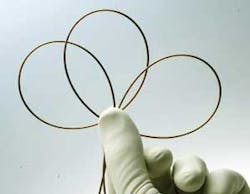 FIGURE 1. Flexible fibers, made of polymer (with some glass in the mirror structure) boast all the advantages of a hollow-core fiber. In addition, they provide low optical losses, high mechanical flexibility, and robustness with bends as small as 2 cm in radius. FIGURE 1. Flexible fibers, made of polymer (with some glass in the mirror structure) boast all the advantages of a hollow-core fiber. In addition, they provide low optical losses, high mechanical flexibility, and robustness with bends as small as 2 cm in radius.