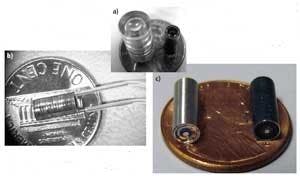 Figure 2. A variety of objectives were manufactured with high-precision, cost-efficient methods: an injection-molded plastic objective with an external system diameter of 8 mm (a, left), and a glass-plastic integrated objective (a, right), both with with NA of 1.0; and hydraulic suction lines connected to the latter (b). A 1.0 NA, 3.8-mm-diameter miniature objective assembled in hypodermic tubing with use of self-centering mounts (c, left) and a similar objective that was built using anodized metal components to reduce stray light within the system (c, right).