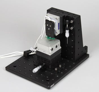 FIGURE 3. A scanning probe microscopy (SPM) instrument is constructed using the Akiyama-probe, nanopositioners, MadPLL instrument controller, and optical components.