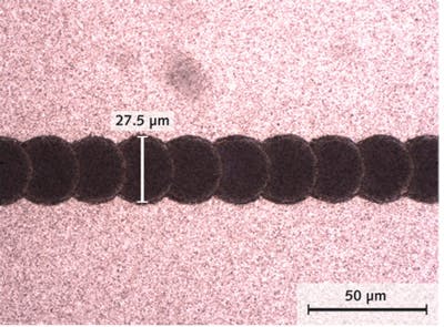 FIGURE 2. In the manufacture of thin-film solar panels with Q-switched DPSS lasers, the high pulse repetition rate and pulse-to-pulse stability of nanosecond micromachining lasers like the Coherent AVIA series are critical to producing clean scribes with the uniform scalloped profile that is needed for certain technical reasons. This image shows a &apos;P2&apos; scribe performed at 532 nm.