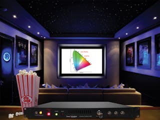 FIGURE 1. An iLLUMINA RGB laser projector containing red- and blue-emitting LDs is shown in a home-theater mockup; this product, which produces a wider color gamut than conventional projectors, will be sized up for movie-cinema use.