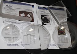 FIGURE 1. Examples of ALON and spinel components produced by Surmet are shown, including a component with a metal grid incorporated into it (upper right). FIGURE 1. Examples of ALON and spinel components produced by Surmet are shown, including a component with a metal grid incorporated into it (upper right).