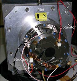 FIGURE 3. This Uniblitz VS35 prototype flight model is seen mounted in a PICARD test fixture. FIGURE 3. This Uniblitz VS35 prototype flight model is seen mounted in a PICARD test fixture.