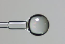 FIGURE 2. A ball lens on the end of a fiber collimates, focuses, or reduces the divergence angle of the light exiting the fiber. FIGURE 2. A ball lens on the end of a fiber collimates, focuses, or reduces the divergence angle of the light exiting the fiber.