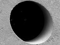 FIGURE 3. High aspect ratio micro holes drilled with an ultrashort pulse laser. FIGURE 3. High aspect ratio micro holes drilled with an ultrashort pulse laser.