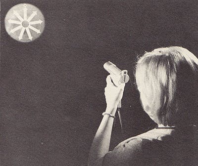 FIGURE 2. Operator aims IBM&apos;s &apos;music pistol&apos; across the room at a sensor (1965).
