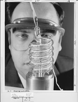FIGURE 1. Press-release photo from Hughes Research Labs showed a larger lamp than Maiman used. The extra power probably helped others reproduce the ruby laser from newspaper accounts. FIGURE 1. Press-release photo from Hughes Research Labs showed a larger lamp than Maiman used. The extra power probably helped others reproduce the ruby laser from newspaper accounts.