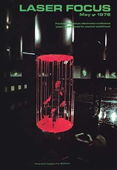 FIGURE 3. Our May 1976 cover featured a scene from the film Logan&apos;s Run, with six 360-degree holograms of Logan&apos;s head being interrogated in the background.