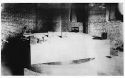 FIGURE 1. The Michelson-Morley experiment was performed on this slab in the basement of a stone dormitory at Western Reserve University in Cleveland. FIGURE 1. The Michelson-Morley experiment was performed on this slab in the basement of a stone dormitory at Western Reserve University in Cleveland.