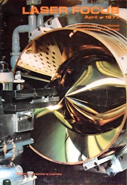 FIGURE 3. The April 1977 issue described diamond machining of metal mirrors, which the Lawrence Livermore National Laboratory used to make aspheric mirrors as large as 38 inches, including the 11.8 inch axicon.