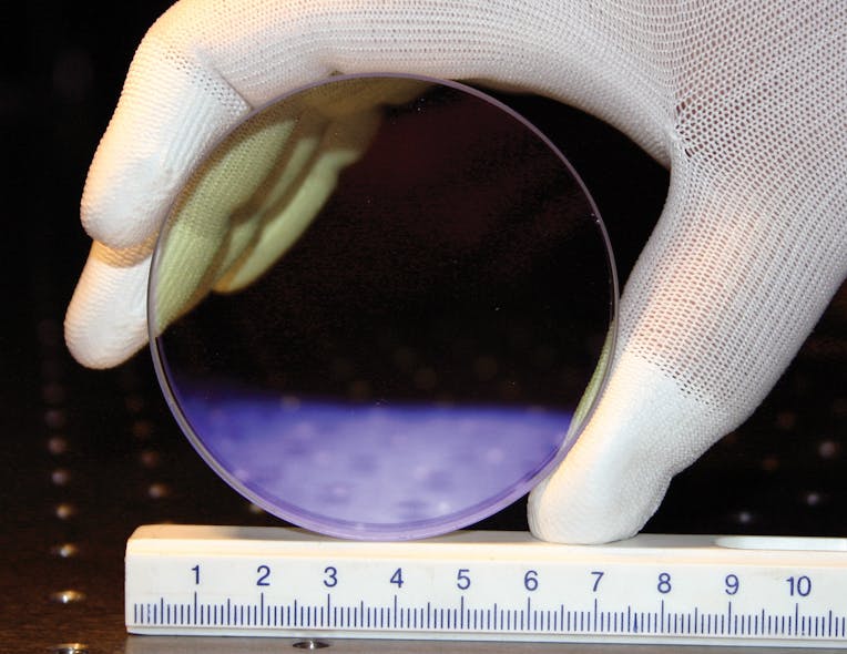 A Yb3+-doped CaF2 crystal is highly transparent in the visible (colors are caused by antireflection coatings).