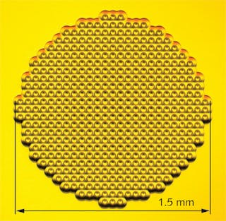 A metamaterial terahertz-radiation-focusing GRIN lens has 60 &mu;m wide unit cells consisting of a 200 nm thick copper film sandwiched between two slabs of benzocyclobutene, a dielectric.