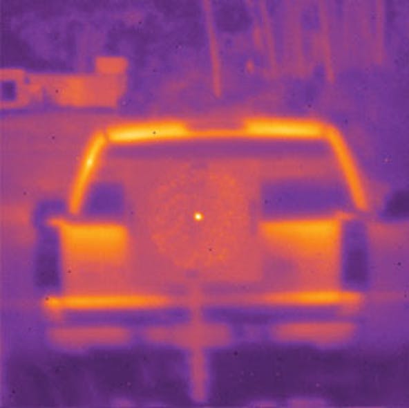 A Tm-fiber laser is shone on a truck 300 m away (top); the indium antimonide camera easily shows the fiber-laser beam as a bright spot in the center of the image, while the larger ring shows cladding light picked up by the sensitive camera. The Tm-fiber laser is powerful enough to be used for atmospheric propagation testing (bottom). Images after 1 km propagation match MODTRAN atmospheric-transmission simulations.