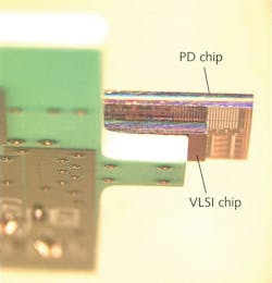 FIGURE 2. A hybrid all-CMOS receiver is mounted in a chip-on-board package. FIGURE 2. A hybrid all-CMOS receiver is mounted in a chip-on-board package.