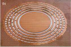 Thermal metamaterial designed to restrict flow of heat to the central circle. Patterns are cut in a 2 mm sheet of copper and when heat flows from left to right in the sheet (which is perforated to limit heat flow), the temperature is uniform across the central, unperforated area. For experiments, the open spaces in the rings are filled with a nonconductive material. Thermal metamaterial designed to restrict flow of heat to the central circle. Patterns are cut in a 2 mm sheet of copper and when heat flows from left to right in the sheet (which is perforated to limit heat flow), the temperature is uniform across the central, unperforated area. For experiments, the open spaces in the rings are filled with a nonconductive material.