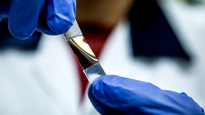 A coiled thin-film material creates circularly polarized light that can be used to aid in recurring cancer detection. The low-cost option could be fitted as a cell-phone attachment. (Image credit: University of Michigan)