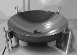 FIGURE 2. A full-size, 600-mm-diameter mirror has just completed the coating step. The central aperture is the entrance position of the laser beam into the plasma chamber in the current source configuration. FIGURE 2. A full-size, 600-mm-diameter mirror has just completed the coating step. The central aperture is the entrance position of the laser beam into the plasma chamber in the current source configuration.