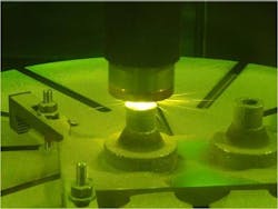 A rocket nozzle is made using a laser-deposition technique that allows for multiple metallic properties in the same object. This technique involves blowing multiple metal powders into a laser beam, so that the laser melts the powder and forms a small pool at the point where the laser touches the part that is being built.