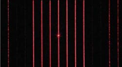 FIGURE 1. A CCD captures the image of a diffraction pattern with seven lines that is produced by a diffractive optical element. Each line consists of 301 spots and the area defined by the lines is 44 &times; 61 mm at a distance of 500 mm from the DOE.