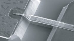 FIGURE 1. Scanning electron micrograph of an air-bridge Schottky barrier diode made at CNR-IFN shows that the metal connection between the anode pad and the Schottky junction has been suspended in order to reduce parasitic capacitance. The suspended structure was obtained by wet chemical removal of the GaAs under the metal bridge, after lithographic definition of the two mesas.