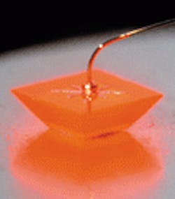 Visible-spectrum light-emitting-diode chip is shaped like a truncated inverted pyramid. The geometry permits a short photon path length, which raises light-extraction efficiency. Visible-spectrum light-emitting-diode chip is shaped like a truncated inverted pyramid. The geometry permits a short photon path length, which raises light-extraction efficiency.